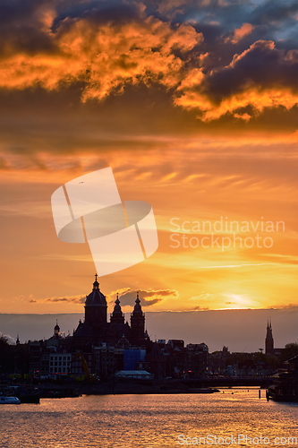 Image of Amsterdam cityscape skyline with Church of Saint Nicholas on su