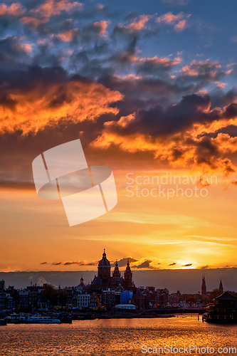 Image of Amsterdam cityscape skyline with Church of Saint Nicholas on su