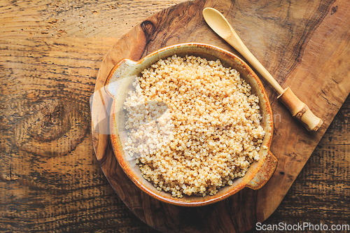 Image of Healthy colorful cooked quinoa. Superfood, gluten-free food on wooden background