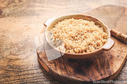 Image of Healthy colorful cooked quinoa. Superfood, gluten-free food on wooden background