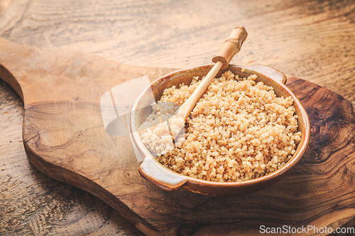 Image of Healthy colorful cooked quinoa. Superfood, gluten-free food on wooden background