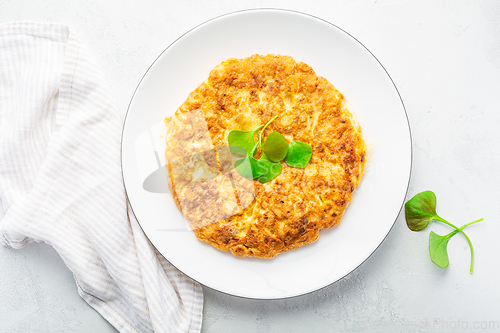 Image of Spanish omelet (Tortilla de patatas) with potatoes and onion