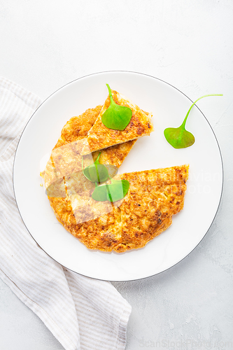 Image of Spanish omelet (Tortilla de patatas) with potatoes and onion