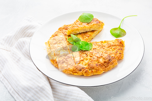 Image of Spanish omelet (Tortilla de patatas) with potatoes and onion