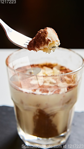 Image of Tiramisu in glass, traditional coffee flavored Italian dessert made of ladyfingers and mascarpone.