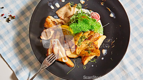 Image of The grilled squid with salad. Shallow dof.