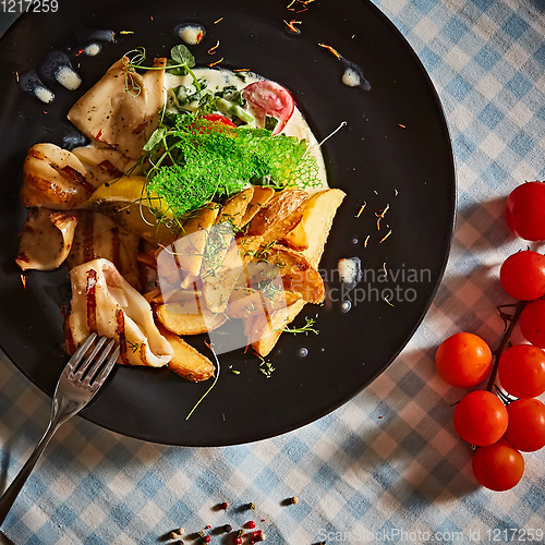 Image of The grilled squid with salad. Shallow dof.