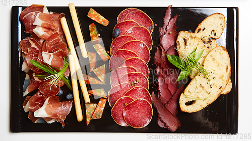 Image of Antipasto Platter Cold meat plate with grissini breadsticks.
