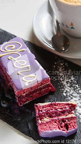 Image of The opera cake with latte. Shallow dof.