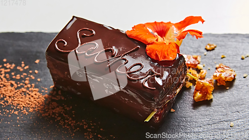 Image of A piece of Sacher cake. Shallow dof.