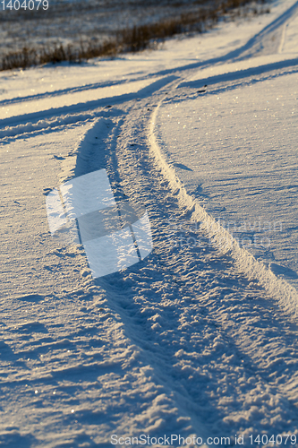 Image of traces of the wheels of the car close-up