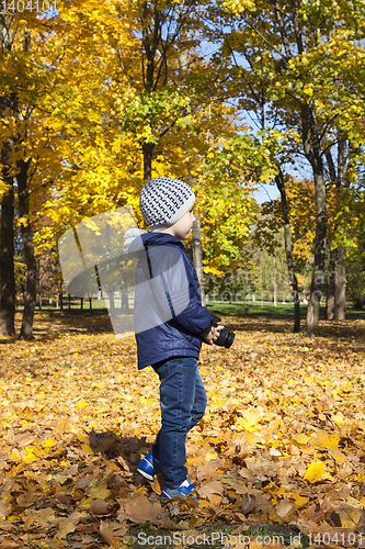 Image of a boy walking in the park