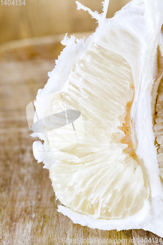 Image of Peeled ripe yellow grapefruit