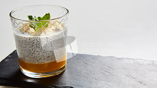 Image of Mango yogurt with chia seeds for healthy breakfast on a white background