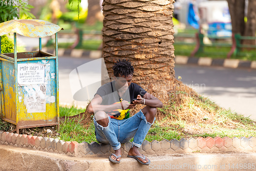 Image of Young man use mobile phone, Ethiopia