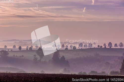 Image of Fall foggy and misty sunrise landscape