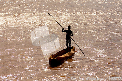 Image of wooden coarse boat on mystical Omo river, Ethiopia