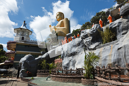 Image of Buddhist monk statues going to Gold Buddha temple