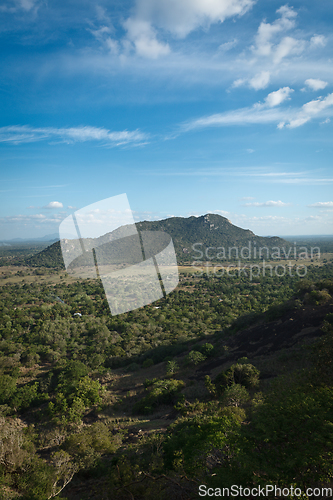 Image of Sky above small mountains