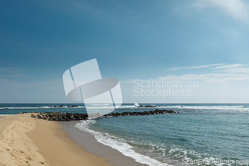 Image of Wave breaker on beach