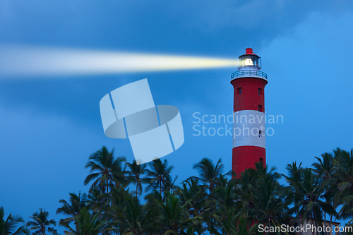 Image of Lighthouse in night with light beam