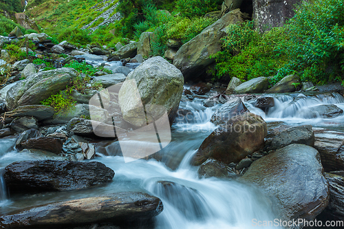 Image of Cascade falls over mossy rocks