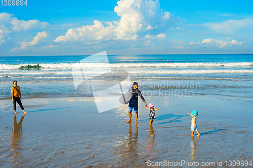 Image of Surfers family children beach. Bali 