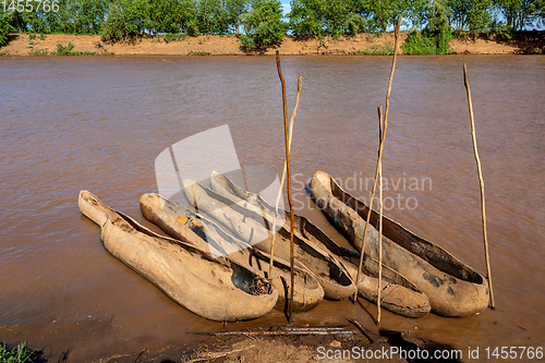 Image of wooden coarse boat on mystical Omo river, Ethiopia