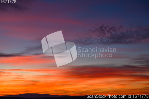 Image of very colorful red, blue, orange and violet late sunset