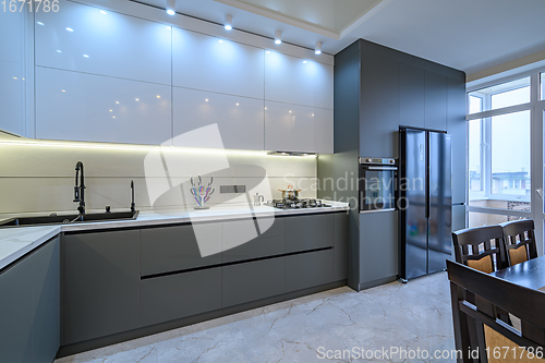 Image of Luxury white and dark grey modern kitchen interior