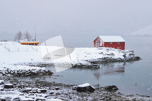 Image of Red rorbu house in winter, Lofoten islands, Norway