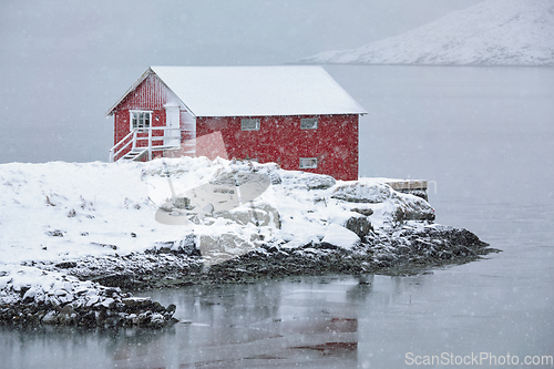 Image of Red rorbu house in winter, Lofoten islands, Norway