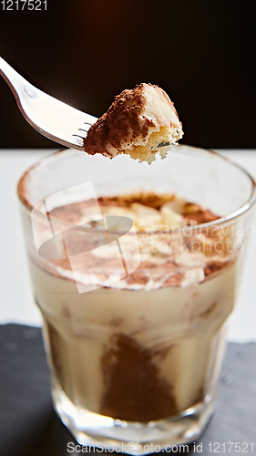 Image of Tiramisu in glass, traditional coffee flavored Italian dessert made of ladyfingers and mascarpone.
