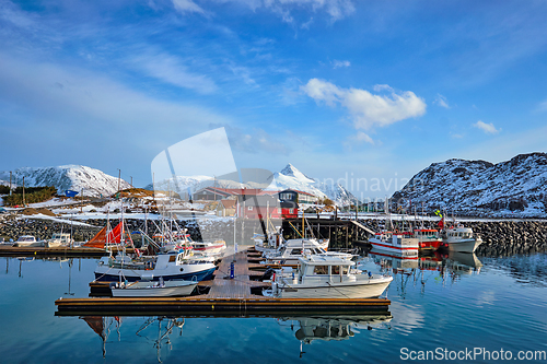 Image of Fishing boats and yachts on pier in Norway