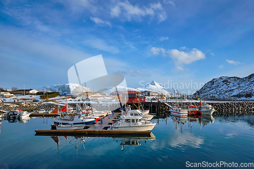 Image of Fishing boats and yachts on pier in Norway