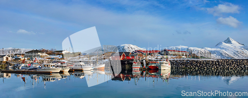 Image of Fishing boats and yachts on pier in Norway