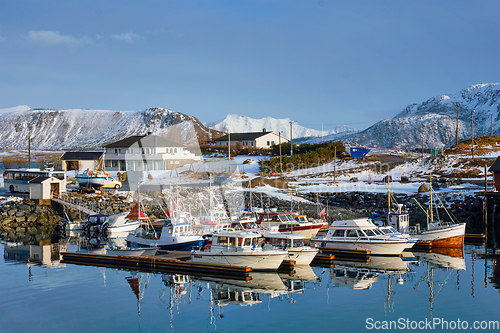 Image of Fishing boats and yachts on pier in Norway