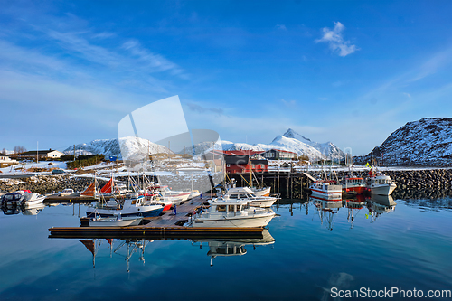 Image of Fishing boats and yachts on pier in Norway