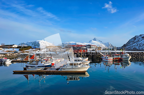 Image of Fishing boats and yachts on pier in Norway