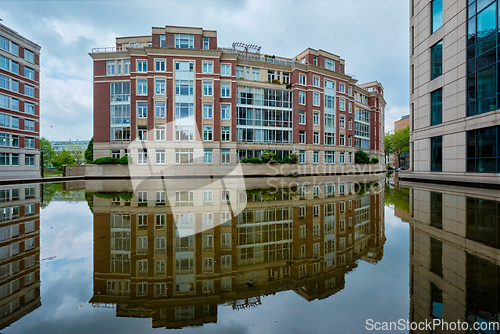 Image of Modern apartment building house with reflection