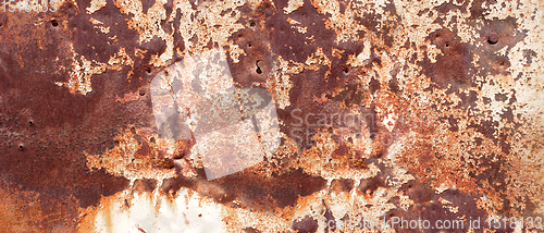 Image of old rusty painted metal banner