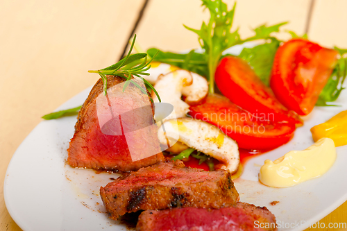 Image of beef filet mignon grilled with vegetables