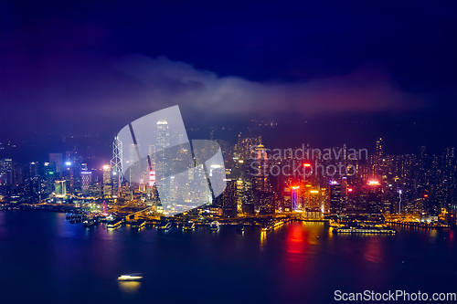 Image of Aerial view of illuminated Hong Kong skyline. Hong Kong, China