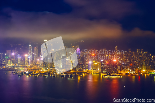 Image of Aerial view of illuminated Hong Kong skyline. Hong Kong, China