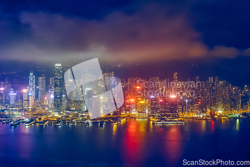 Image of Aerial view of illuminated Hong Kong skyline. Hong Kong, China