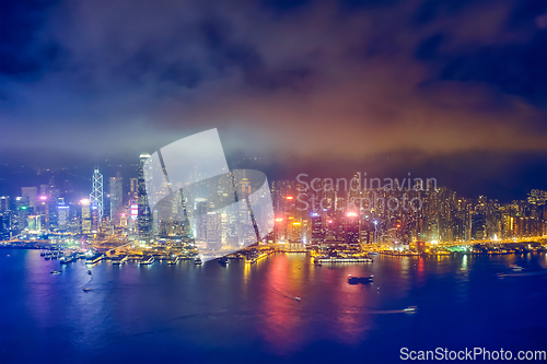 Image of Aerial view of illuminated Hong Kong skyline. Hong Kong, China