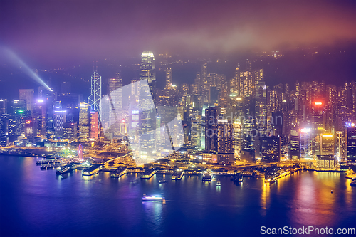 Image of Aerial view of illuminated Hong Kong skyline. Hong Kong, China