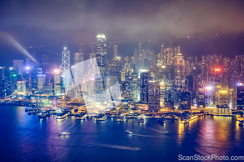 Image of Aerial view of illuminated Hong Kong skyline. Hong Kong, China