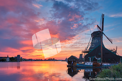 Image of Windmills at Zaanse Schans in Holland on sunset. Zaandam, Nether