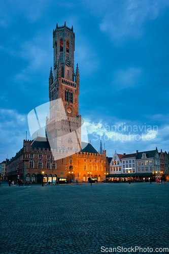 Image of Belfry tower and Grote markt square in Bruges, Belgium on dusk in twilight